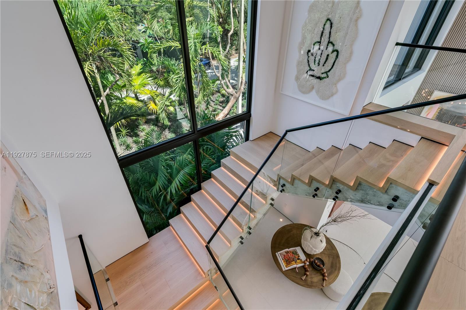 2800 Calusa Street Miami, FL 33133 - Photo 25 of 71 a view of living room with furniture and a large window