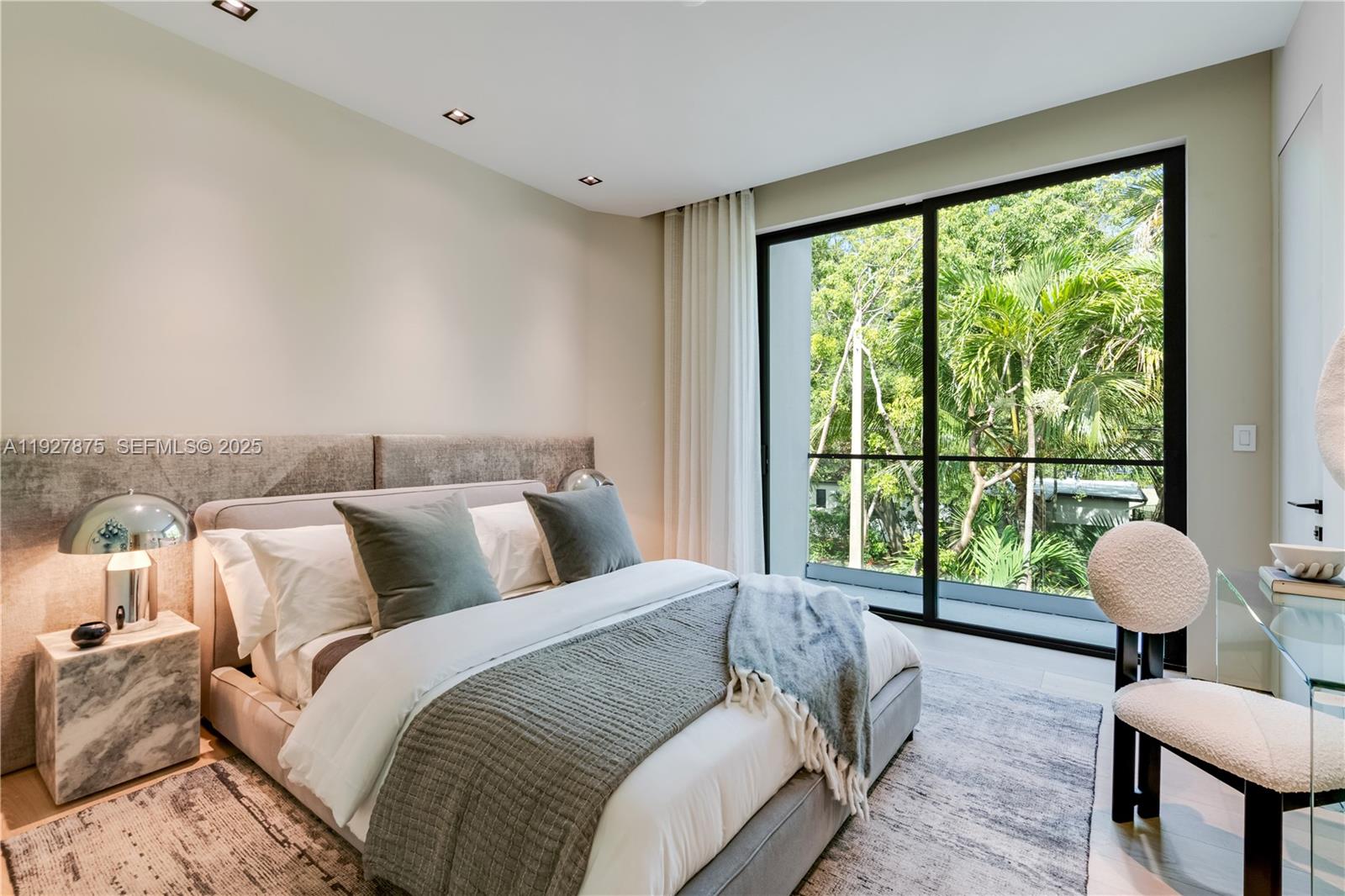 2800 Calusa Street Miami, FL 33133 - Photo 48 of 71 a bedroom with a bed and a large window