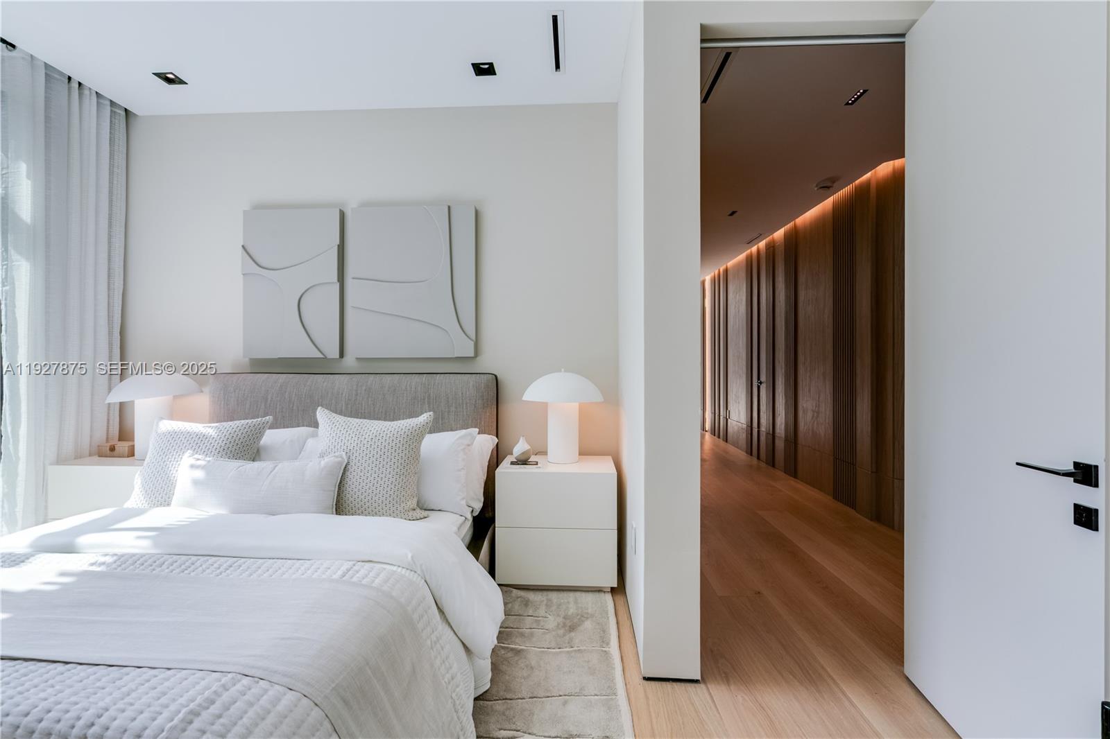 2800 Calusa Street Miami, FL 33133 - Photo 50 of 71 a bedroom with a bed and a mirror