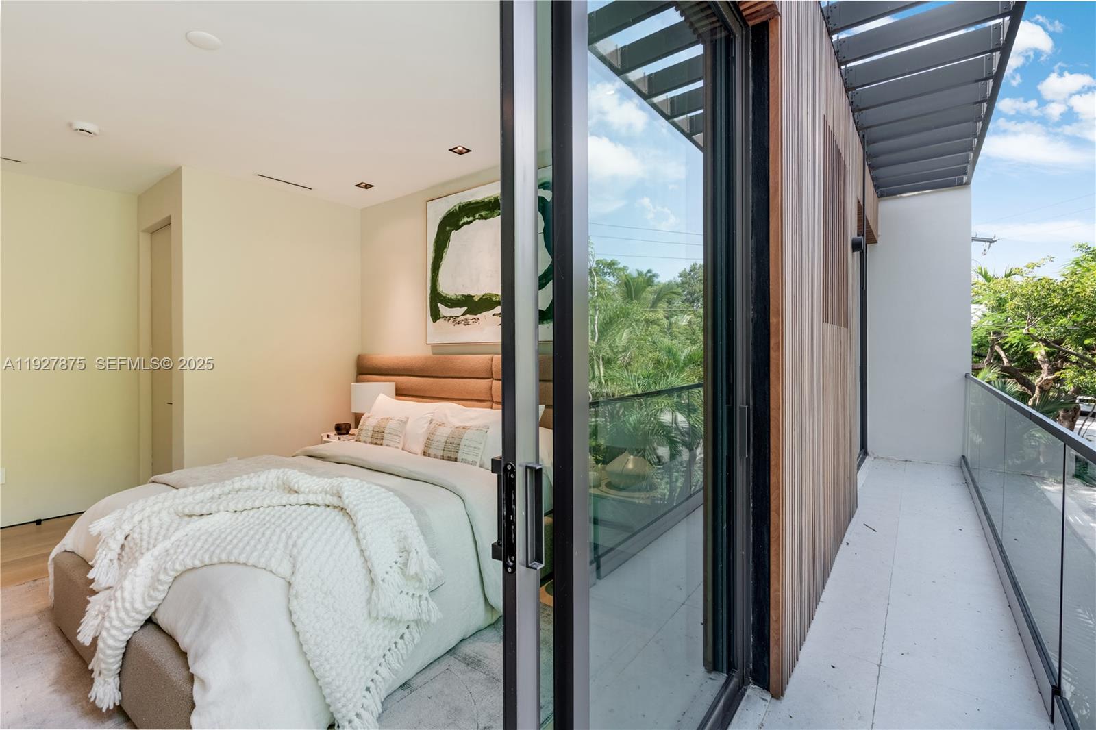 2800 Calusa Street Miami, FL 33133 - Photo 56 of 71 a bed sitting in a bedroom next to a window