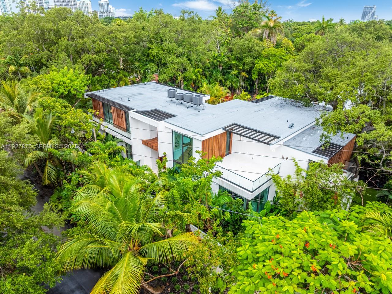 2800 Calusa Street Miami, FL 33133 - Photo 69 of 71 an aerial view of a house with a garden
