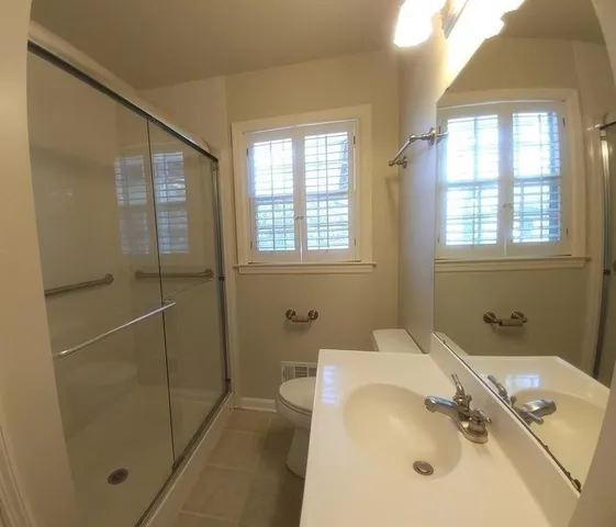 a bathroom with a tub and a sink
