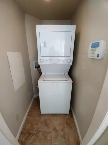 a white toilet sitting in a bathroom next to a sink