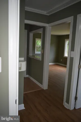 wooden floor in a hall with an entryway