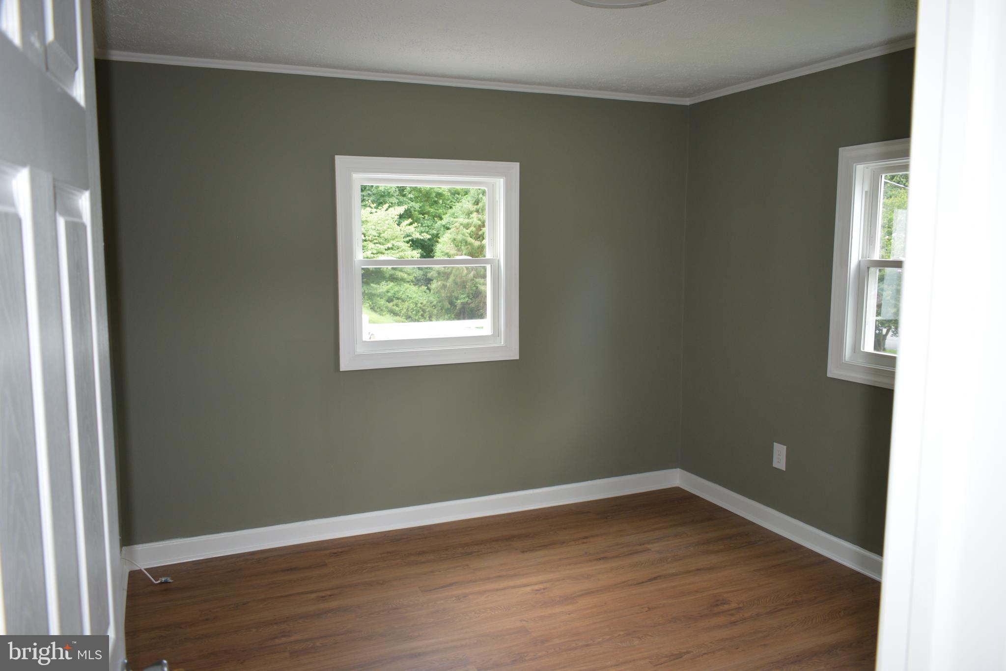 12323 Dewey Silver Spring Silver Spring, MD 20906 - Photo 13 of 37 an empty room with wooden floor and a window