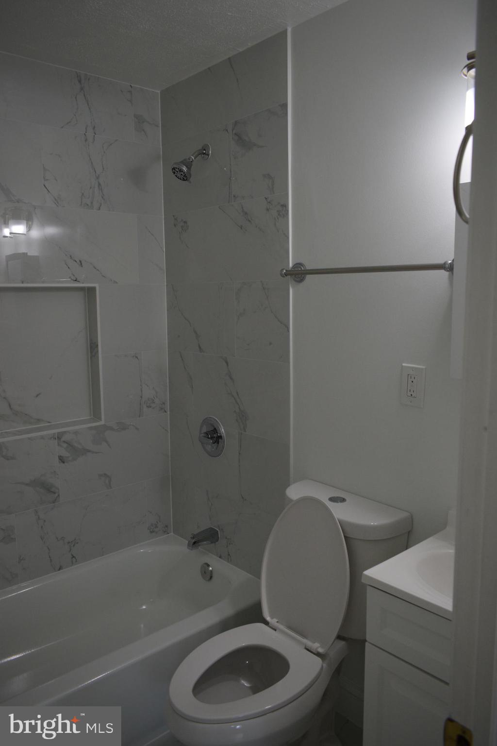 12323 Dewey Silver Spring Silver Spring, MD 20906 - Photo 20 of 37 a white toilet sitting next to a bath tub