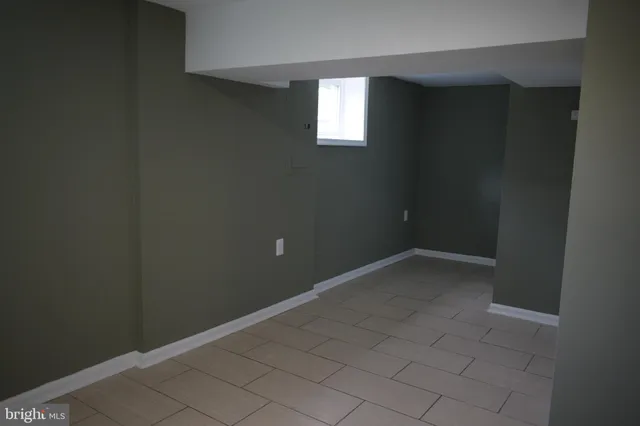 an empty room with a empty space and window