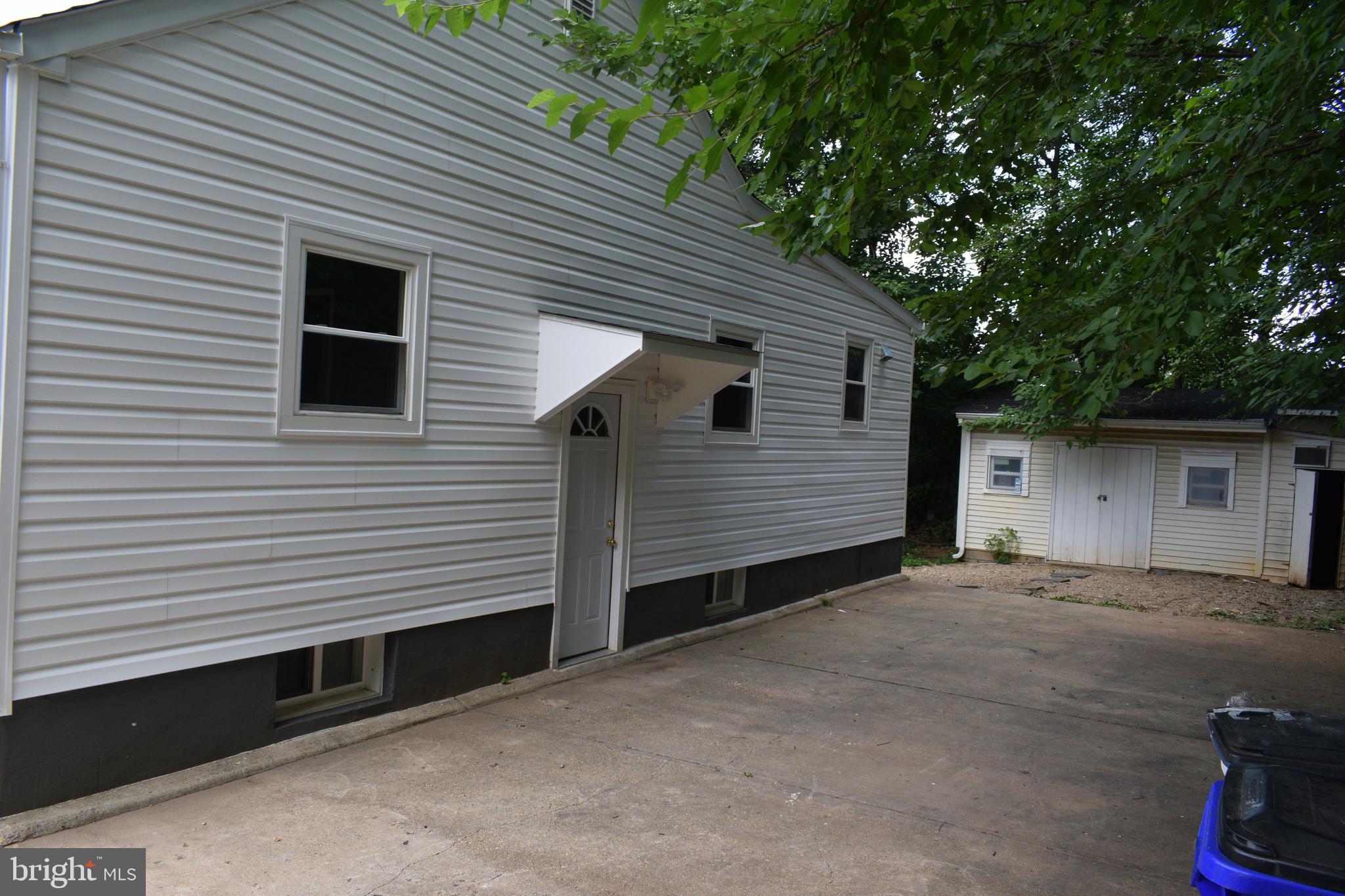 12323 Dewey Silver Spring Silver Spring, MD 20906 - Photo 6 of 37 a front view of a house with a garage