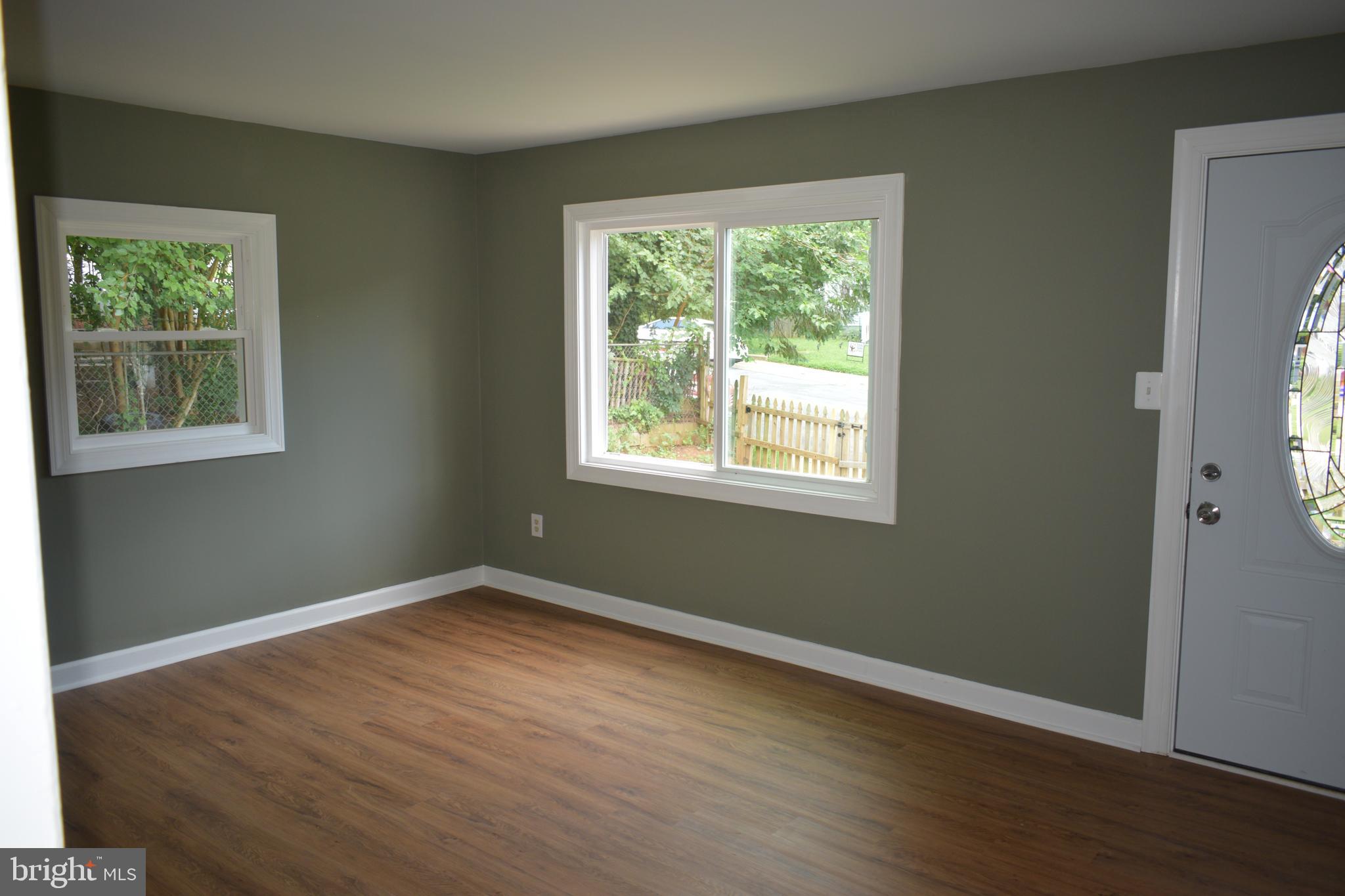 12323 Dewey Silver Spring Silver Spring, MD 20906 - Photo 8 of 37 a view of a big room with wooden floor and windows
