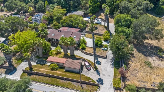 an aerial view of a house with a garden