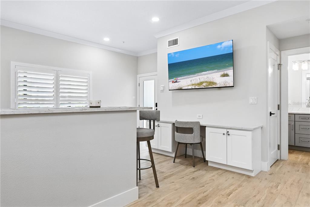 1234 15th Street, Unit 102 Sarasota, FL 34236 - Photo 14 of 30 a view of a workspace with furniture and wooden floor