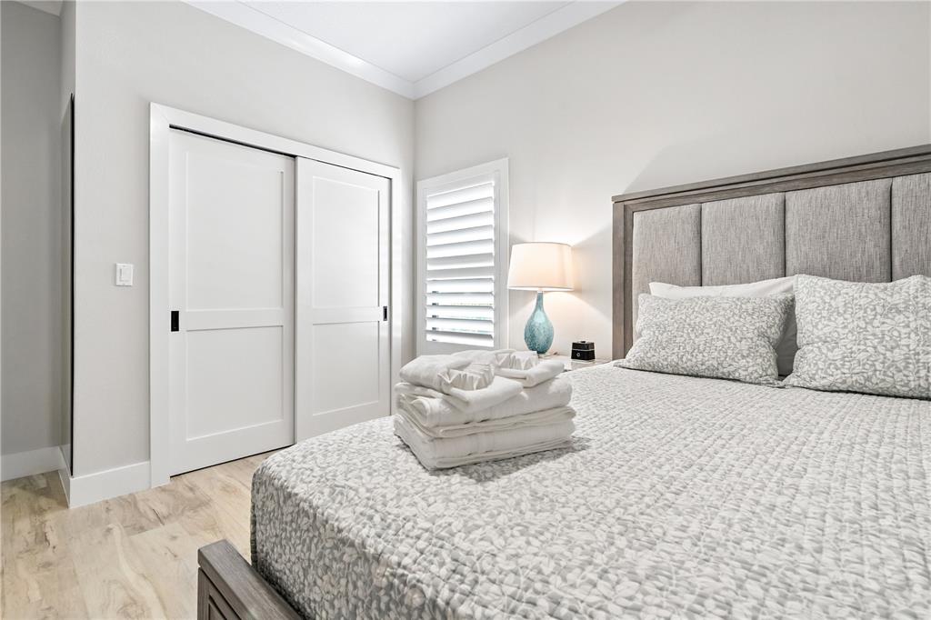 1234 15th Street, Unit 102 Sarasota, FL 34236 - Photo 17 of 30 a bedroom with a bed and a window