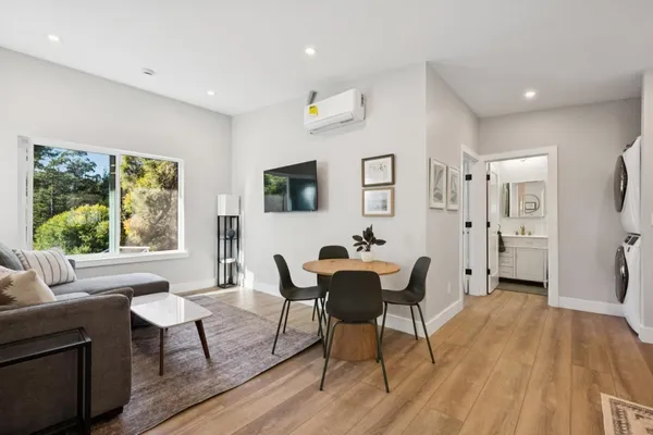 a dining room with furniture and window