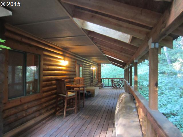 23434 East Bailey Road Rhododendron, OR 97049 - Photo 1 of 16 a view of a porch with furniture and wooden floor