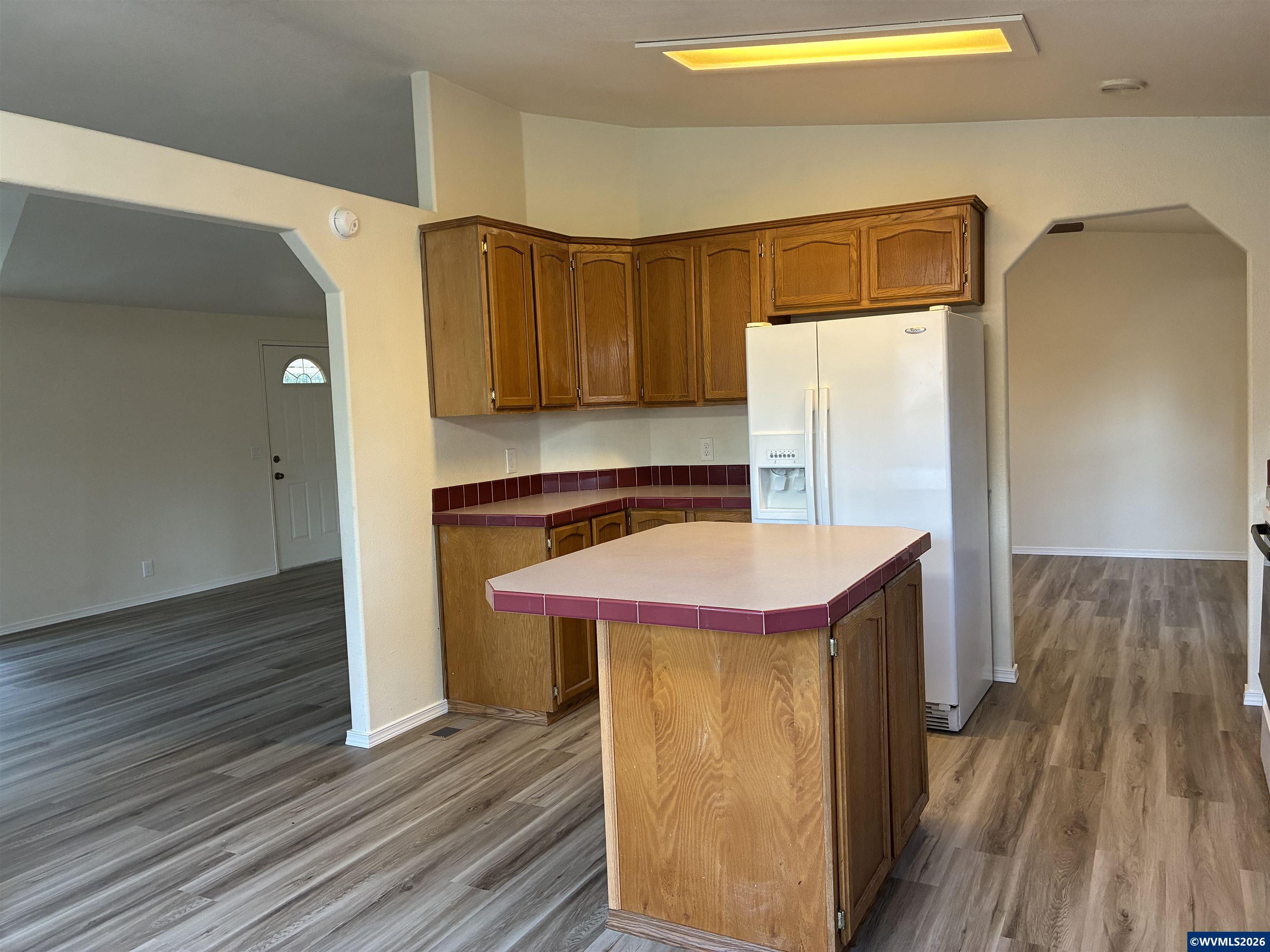 2000 Robins Lane Southeast, Unit 7 Salem, OR 97306 - Photo 8 of 39 a kitchen with a sink and wooden floor