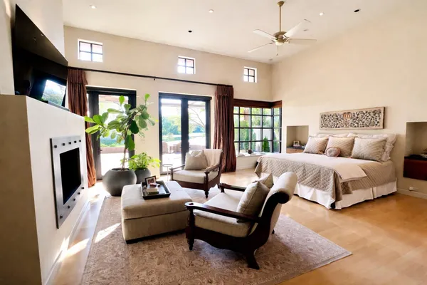 a bedroom with a balcony a bed and a couch