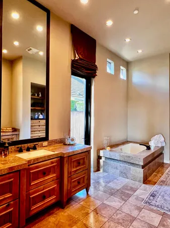 a bedroom with a bed and a view of bathroom
