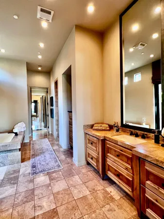 a kitchen with stainless steel appliances granite countertop a stove and a sink