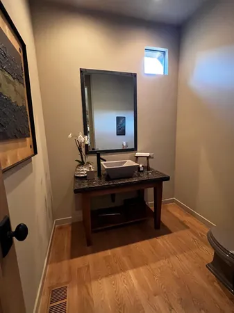 a bedroom with a bed and a mirror