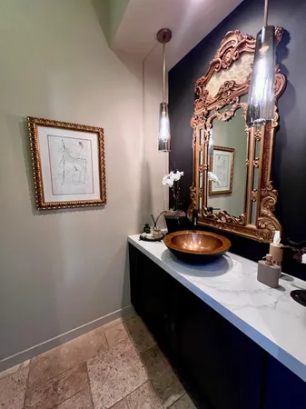 a bedroom with a large bed and a large mirror