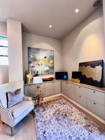 a large bedroom with a large bed and furniture