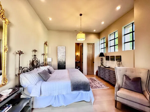 a living room with furniture and a mirror