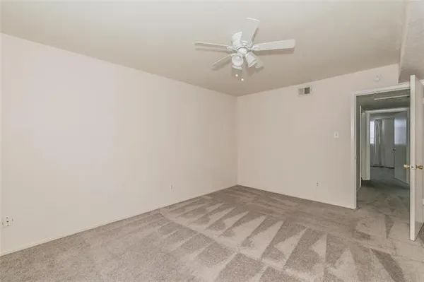 a view of a room with a fan