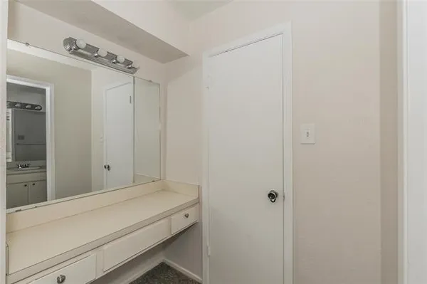 a bathroom with a tub and shower