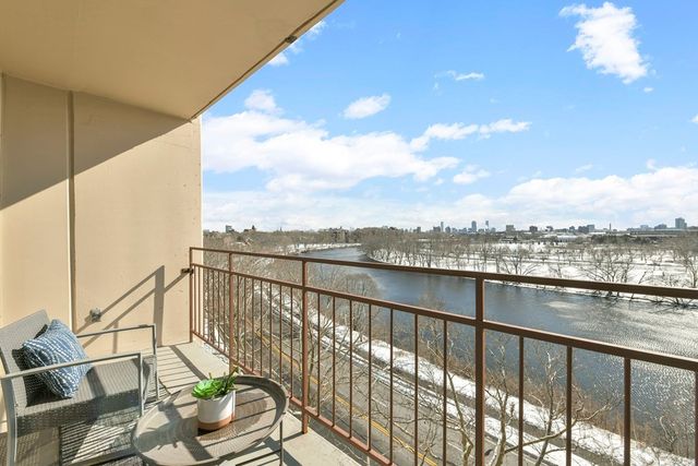 a view of a balcony with lake view and mountain view