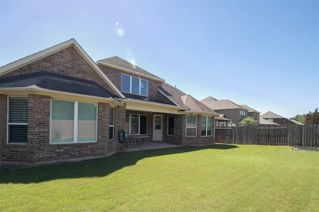 a front view of a house with swimming pool
