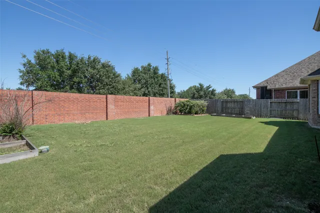 a view of a backyard with a garden