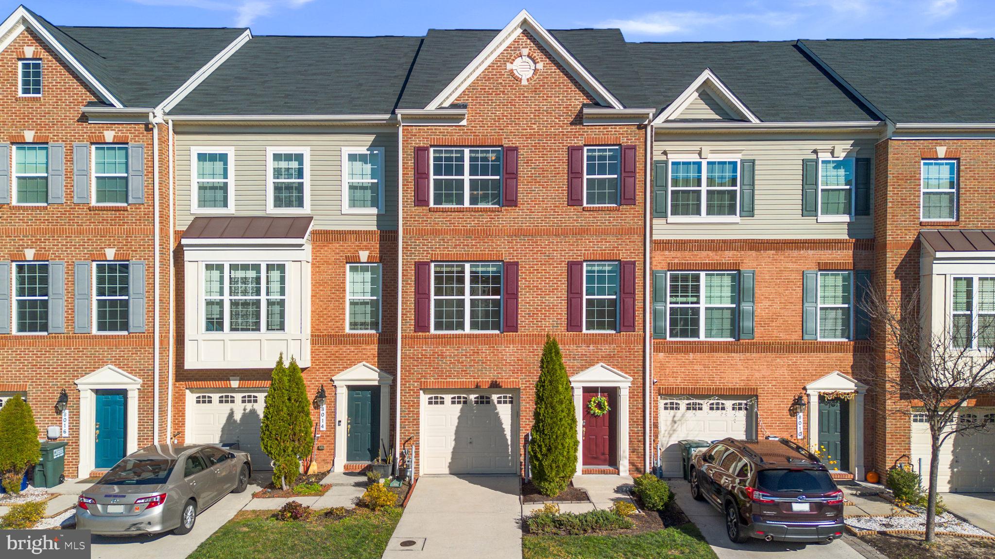 8012 Alchemy Way Elkridge, MD 21075 - Photo 1 of 46 a front view of a residential apartment building with a yard