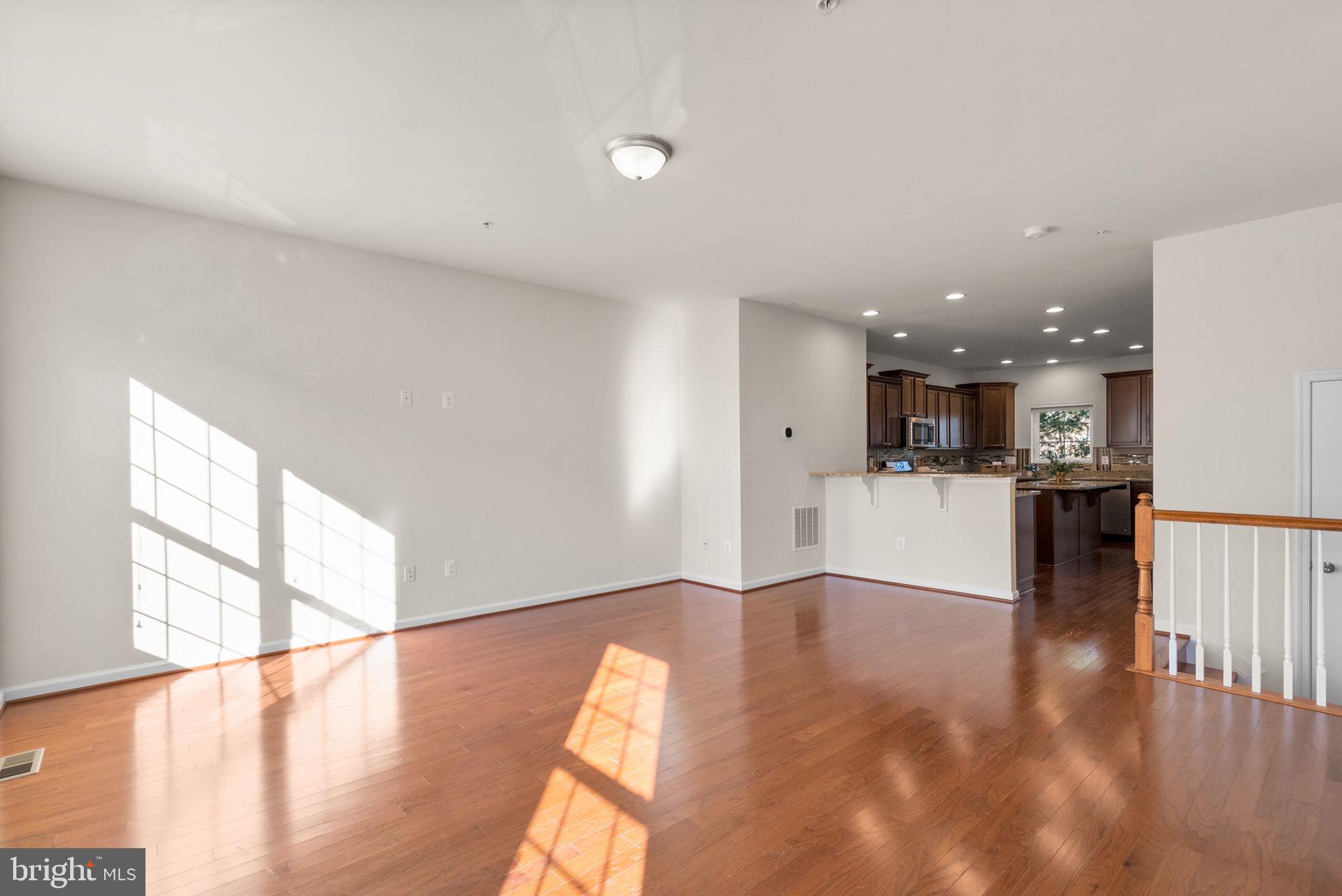 8012 Alchemy Way Elkridge, MD 21075 - Photo 14 of 46 a view of kitchen with wooden floor and windows