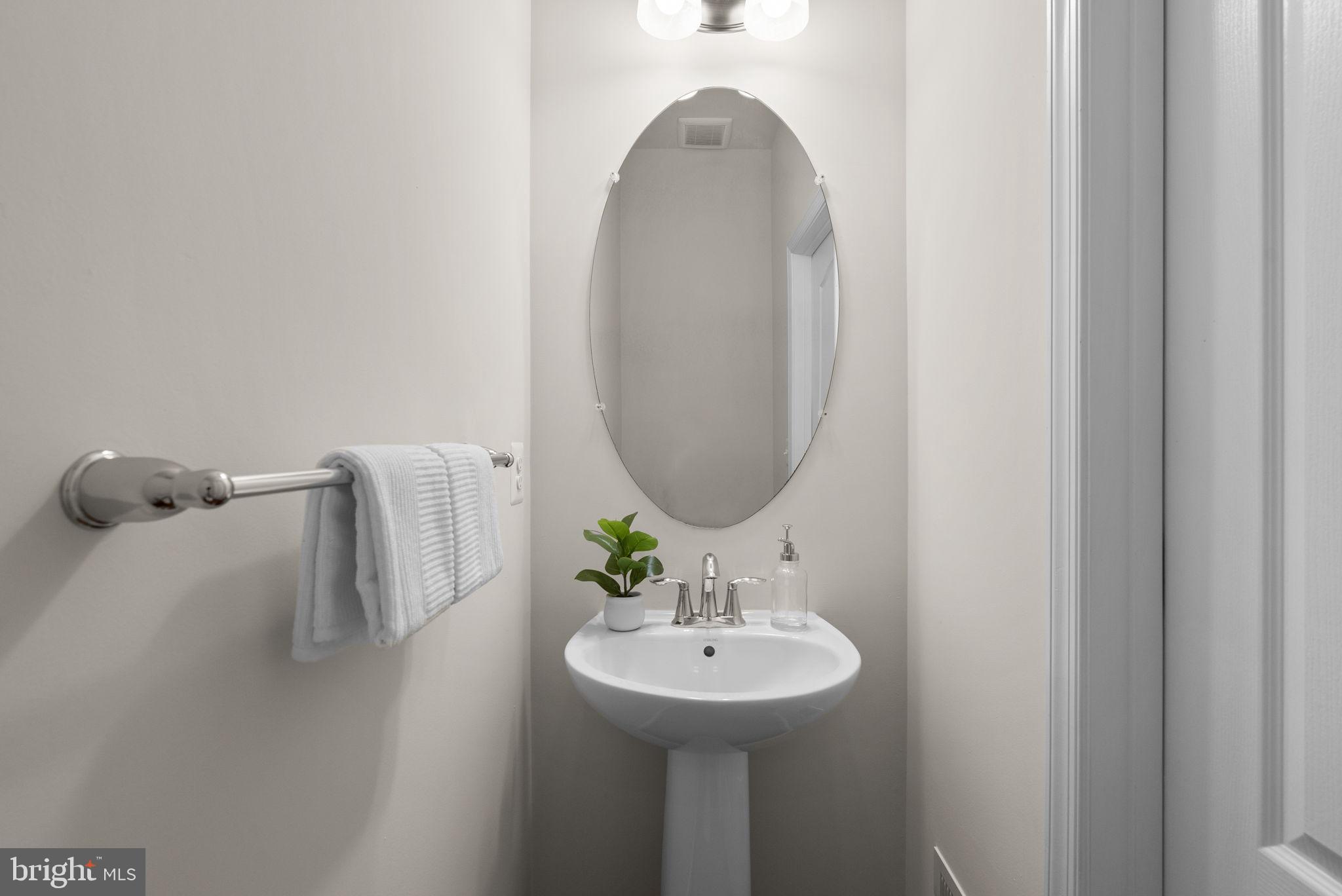 8012 Alchemy Way Elkridge, MD 21075 - Photo 19 of 46 a bathroom with a sink and a mirror