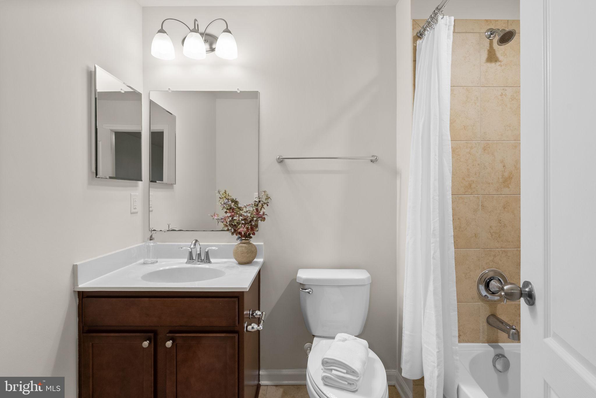 8012 Alchemy Way Elkridge, MD 21075 - Photo 36 of 46 a bathroom with a sink toilet and shower
