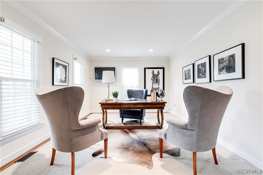 3300 East Weyburn Road Richmond, VA 23235 - Photo 14 of 46 a living room with furniture a dining table and paintings on the wall with wooden floor