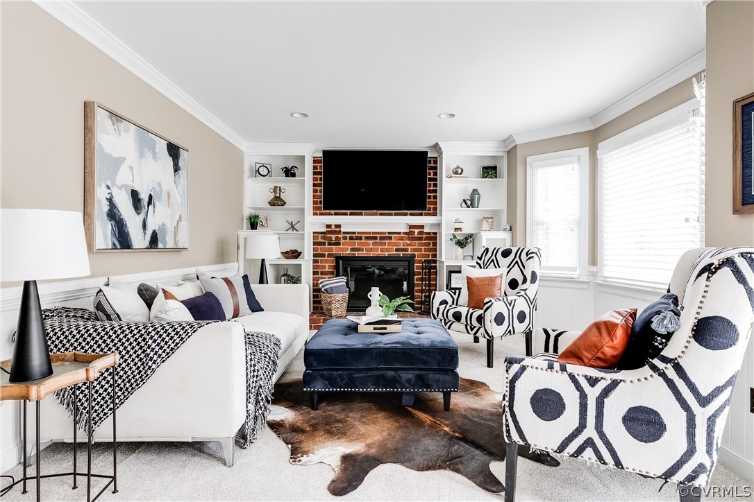 3300 East Weyburn Road Richmond, VA 23235 - Photo 17 of 46 a living room with furniture a flat screen tv and a fireplace