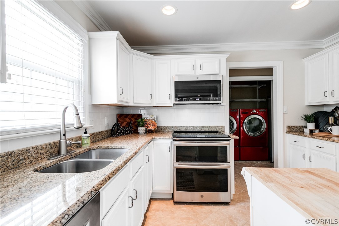 3300 East Weyburn Road Richmond, VA 23235 - Photo 23 of 46 a kitchen with a sink a stove and cabinets