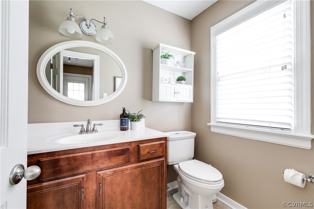 3300 East Weyburn Road Richmond, VA 23235 - Photo 28 of 46 a bathroom with a toilet a sink and a mirror