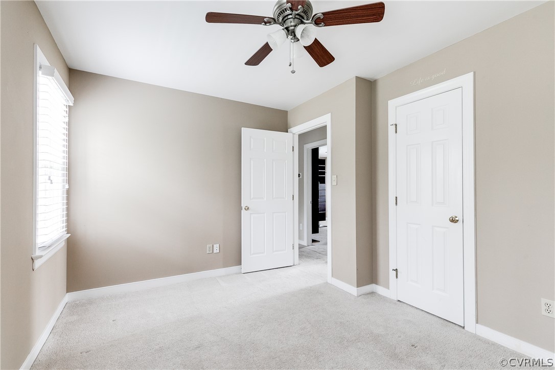 3300 East Weyburn Road Richmond, VA 23235 - Photo 42 of 46 a view of a room with a ceiling fan and a window