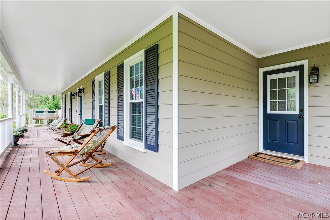 3300 East Weyburn Road Richmond, VA 23235 - Photo 6 of 46 a balcony with wooden floor and furniture