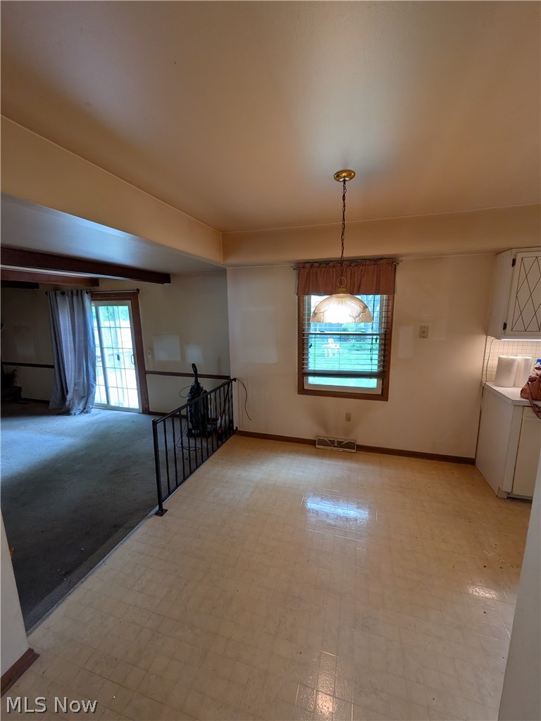 1161 Gulf Road Elyria, OH 44035 - Photo 14 of 34 Dining area with tiled flooring, a single window, and an overhead light fixture