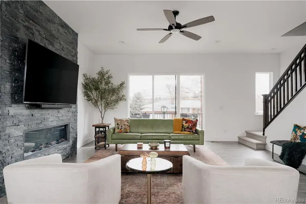a living room with furniture fireplace and a flat screen tv