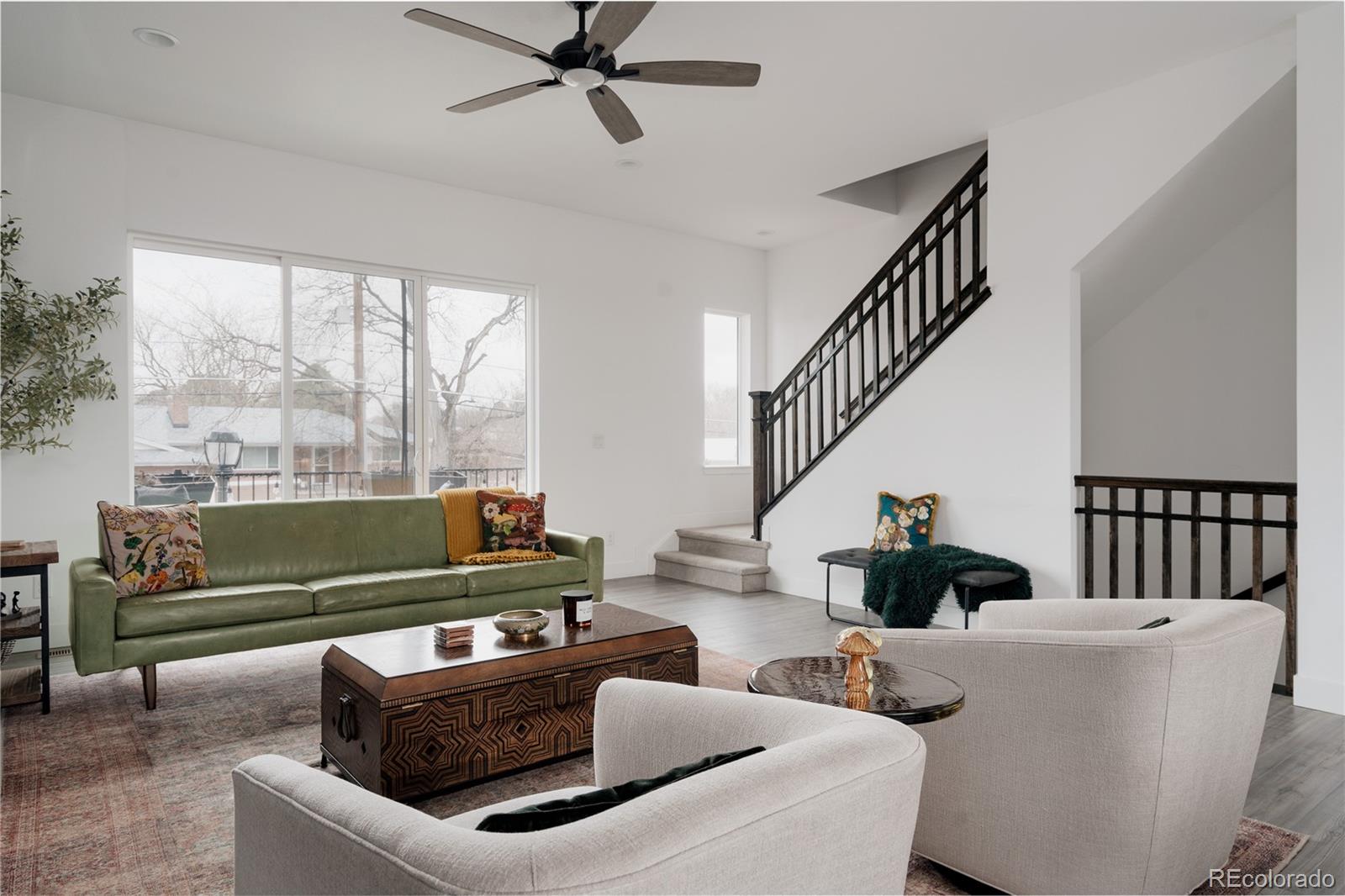 11890 West 52nd Avenue Wheat Ridge, CO 80033 - Photo 19 of 44 a living room with furniture and a large window