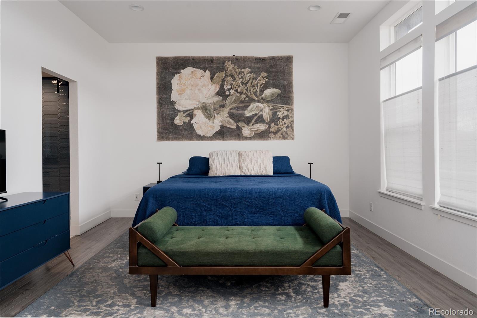 11890 West 52nd Avenue Wheat Ridge, CO 80033 - Photo 22 of 44 a bedroom with a bed and a window