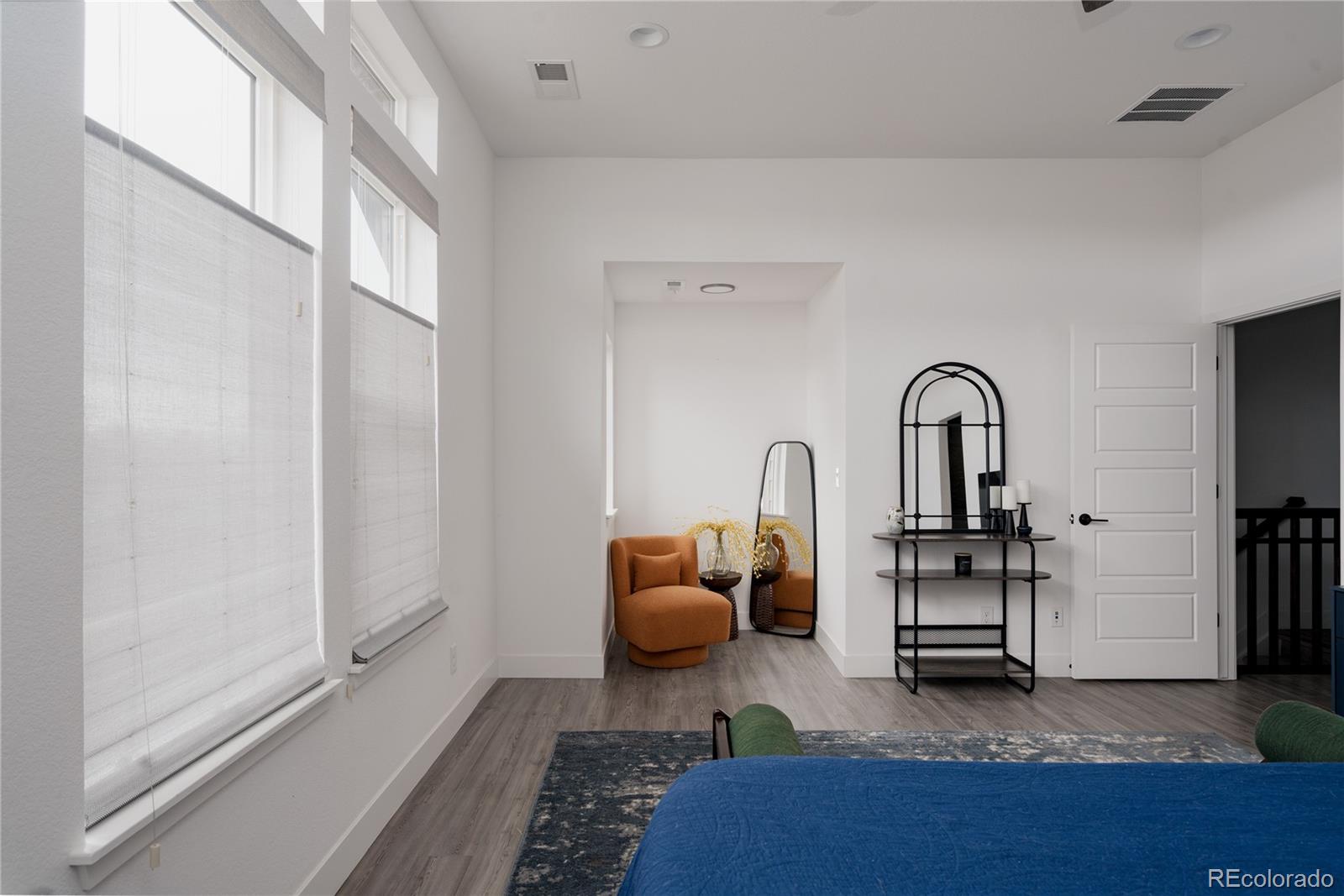 11890 West 52nd Avenue Wheat Ridge, CO 80033 - Photo 26 of 44 a living room with furniture a rug and potted plant