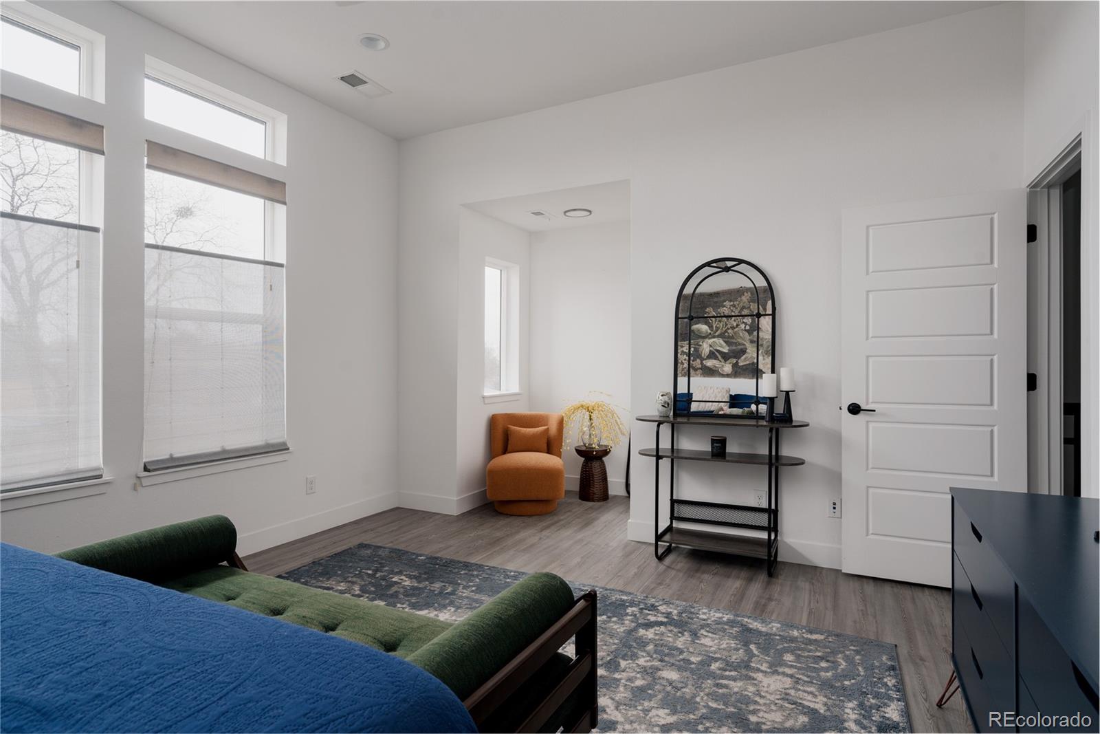 11890 West 52nd Avenue Wheat Ridge, CO 80033 - Photo 34 of 44 a living room with furniture and a rug