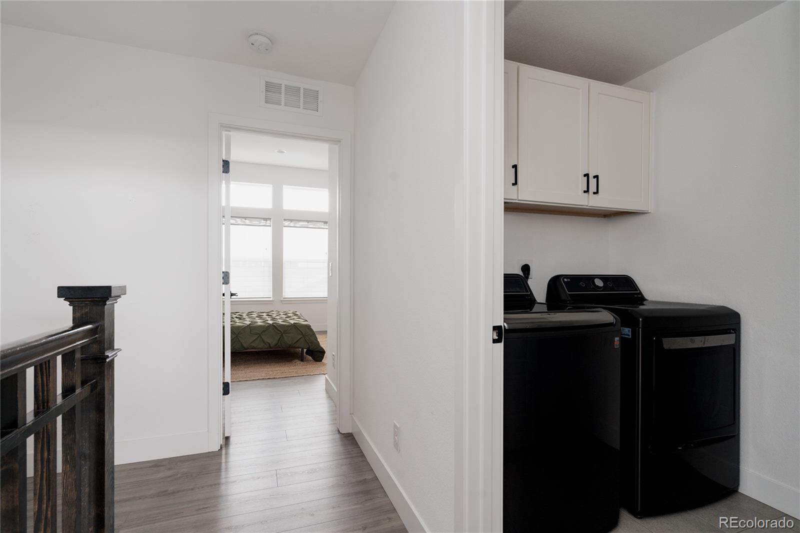 11890 West 52nd Avenue Wheat Ridge, CO 80033 - Photo 39 of 44 a view of bedroom with furniture and wooden floor