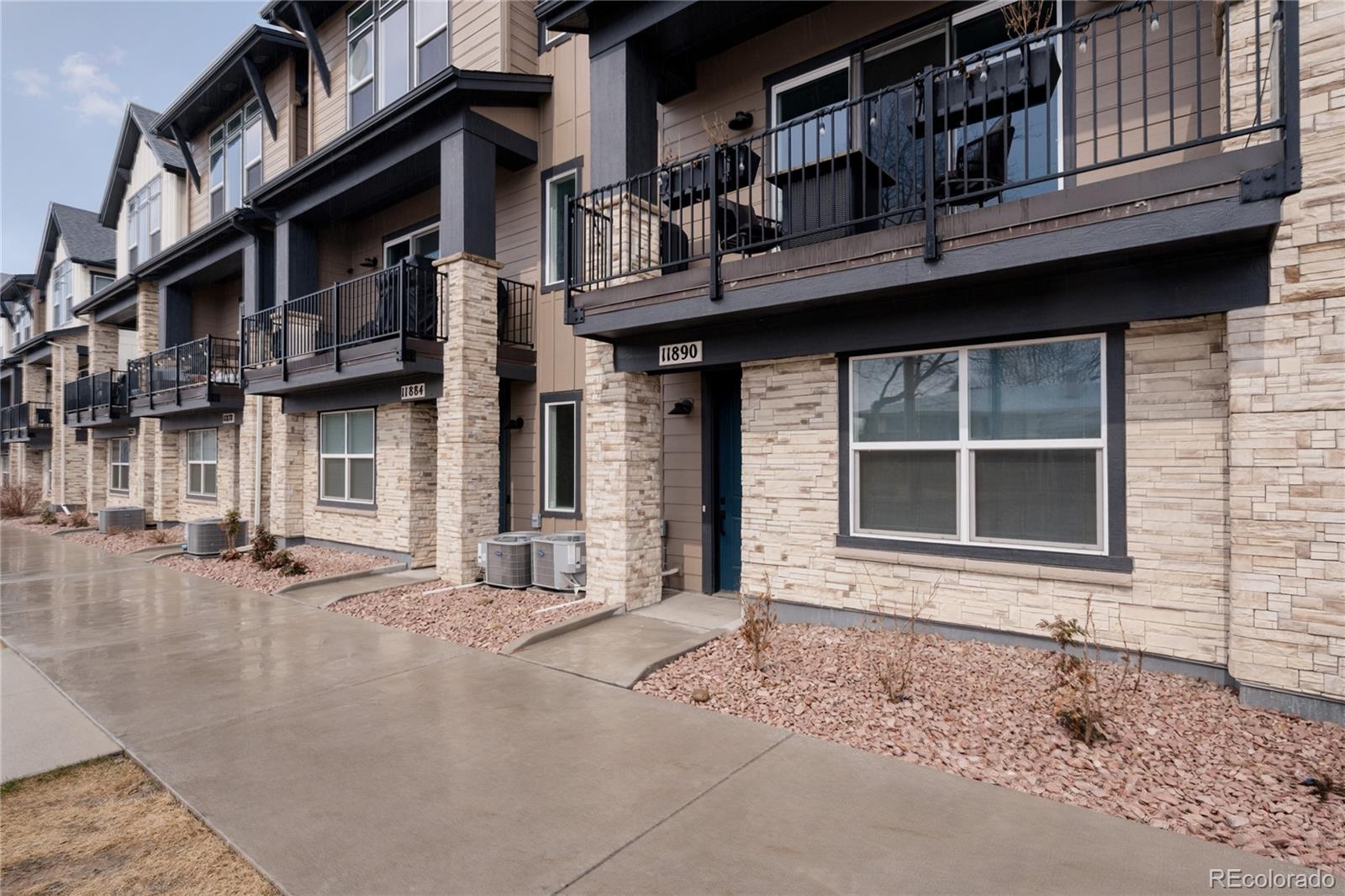 11890 West 52nd Avenue Wheat Ridge, CO 80033 - Photo 4 of 44 a front view of a building with a lot of windows