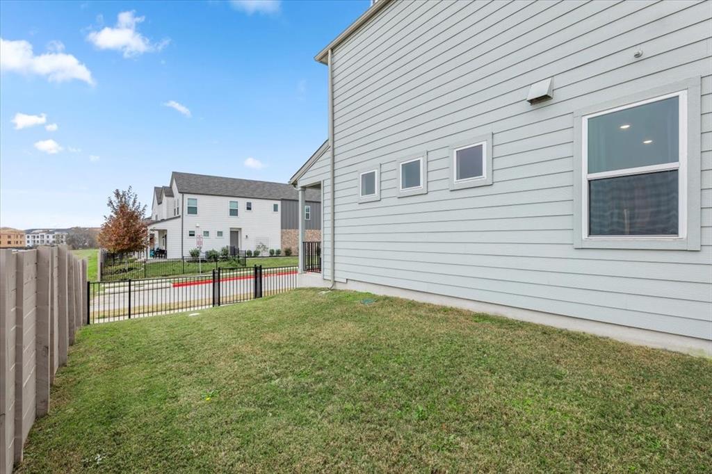 7401 Grand Linden Way, Unit 78 Austin, TX 78744 - Photo 12 of 17 a view of backyard with trampoline